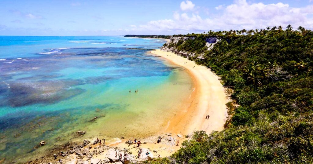 A picturesque view of Praia do Espelho, with its crystal-clear waters and pristine sands, located in Bahia, Brazil.