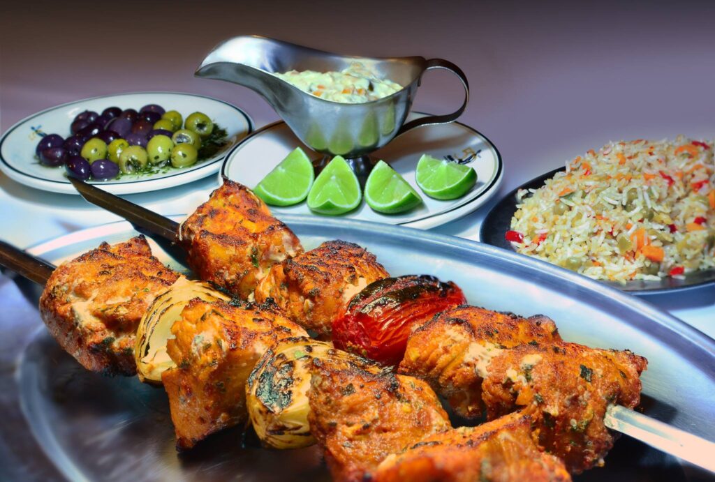 A plate of Pintado na Brasa, a smoky and tender grilled fish dish from Brazil's Pantanal, known for its rich flavors and rustic presentation.