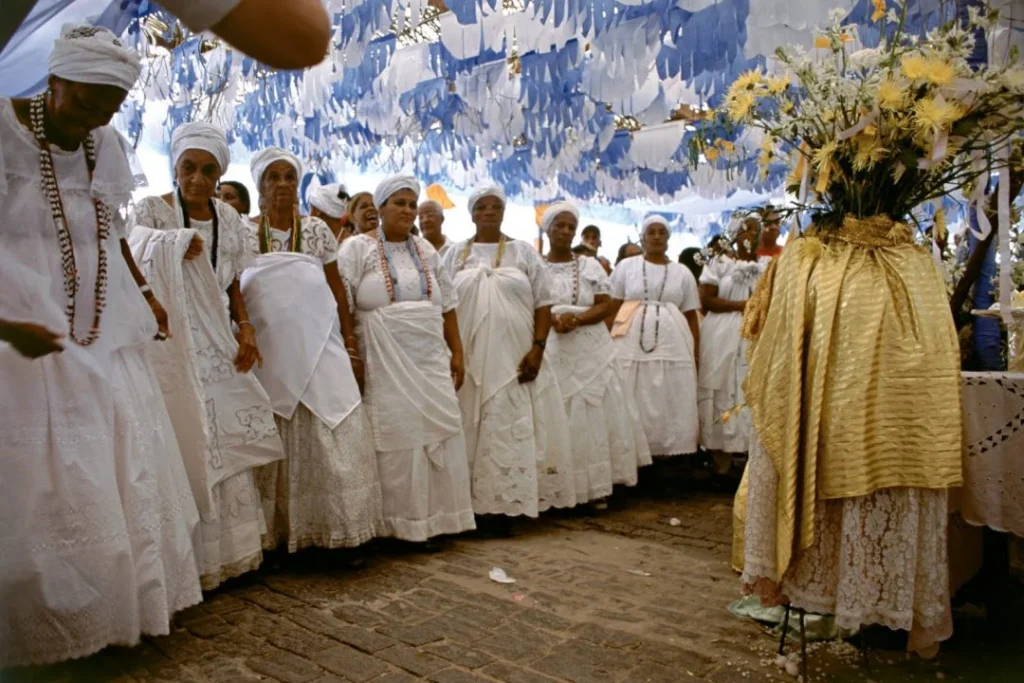 A Candomblé practitioner performing a ritual dance, dressed in traditional attire, embodying the spiritual and cultural significance of Afro-Brazilian heritage.