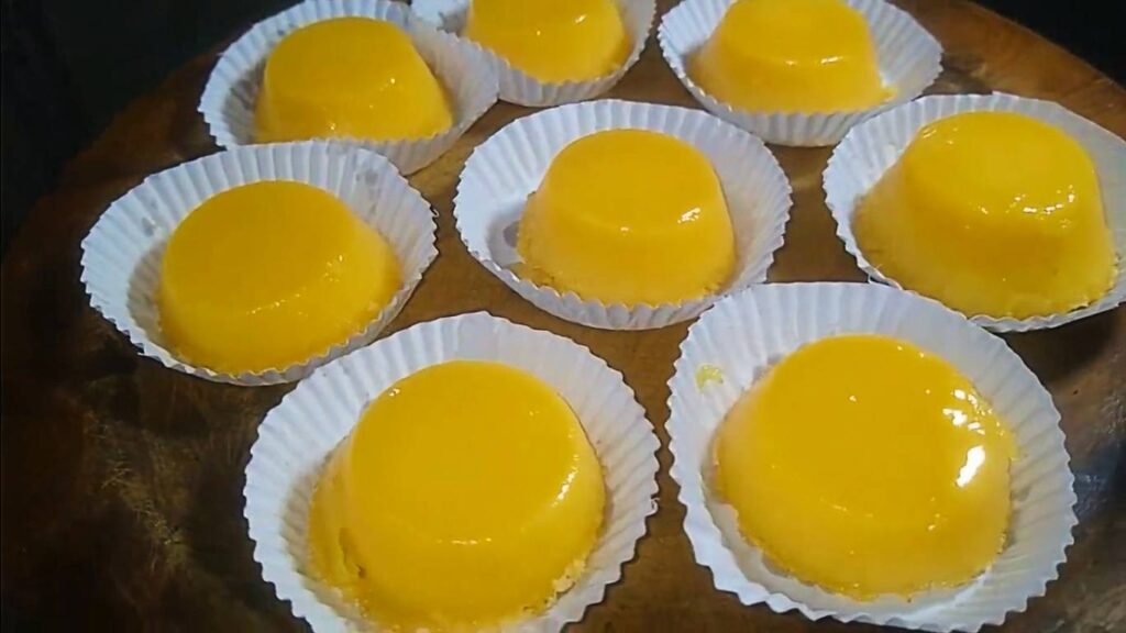 Quindim, a traditional Brazilian dessert made with coconut, sugar, egg yolks, and butter, offering a sweet and smooth custard texture.