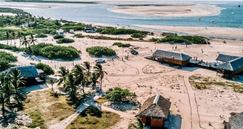 A scenic view of Atins, a peaceful village near Lençóis Maranhenses, featuring sandy streets, rustic pousadas, and a laid-back atmosphere by the coast.