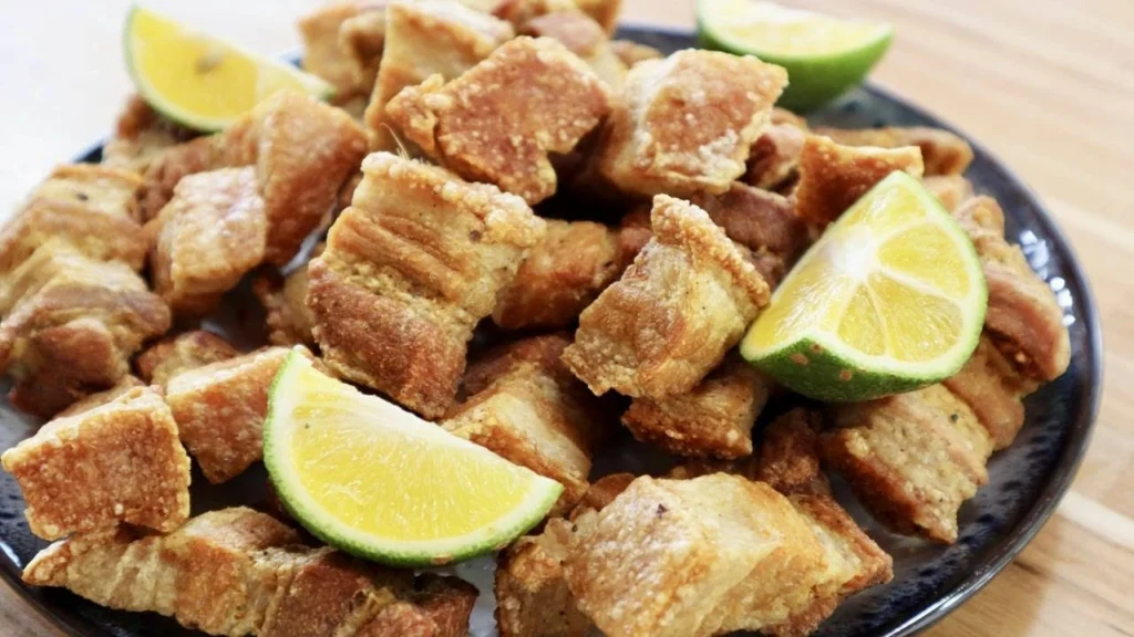 "Golden and crispy torresmo, a beloved Brazilian pork crackling served with Feijoada."

